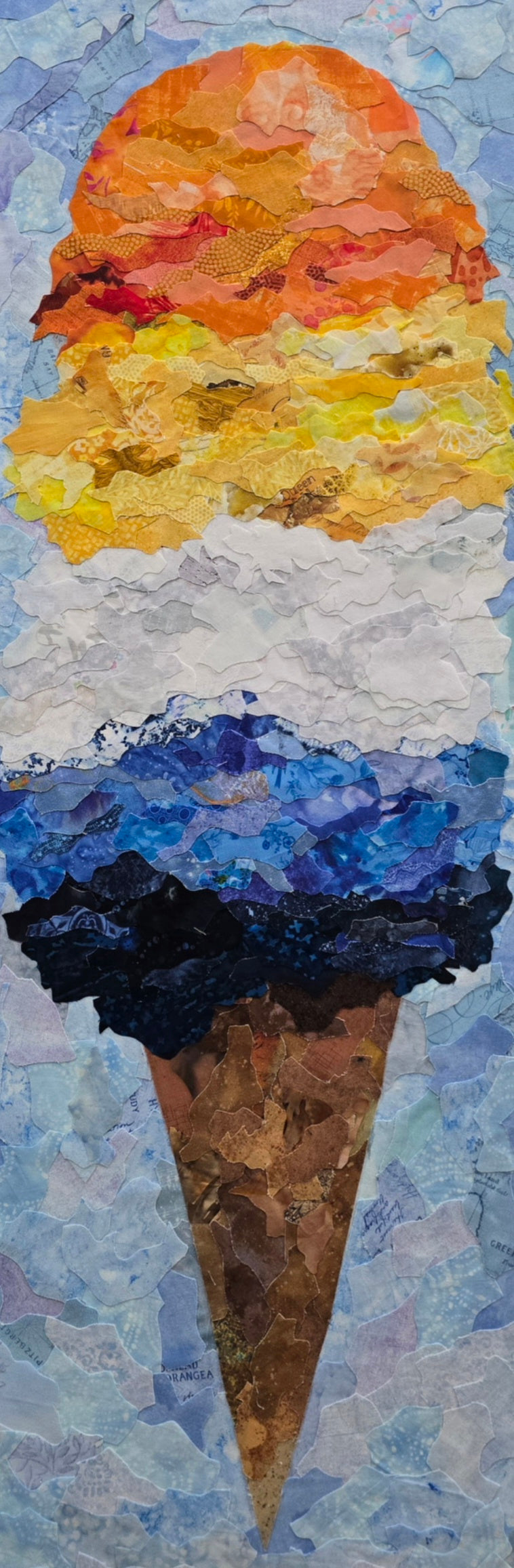 A fabric collage of a colorful ice cream cone created in the colors of the ARO/ACE pride flag, orange, yellow, white, blue and navy blue scoops create the image.  12x36 inches in size. 